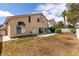 The backyard includes a grass area, a concrete patio, and the back of the home at 7620 Tortola Bay Ln, Las Vegas, NV 89128