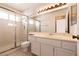 Bathroom with glass shower and vanity with generous counter space at 7620 Tortola Bay Ln, Las Vegas, NV 89128
