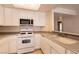 Bright kitchen with white cabinetry at 7620 Tortola Bay Ln, Las Vegas, NV 89128