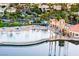 Lagoon style pool with beach entry and umbrellas at 7620 Tortola Bay Ln, Las Vegas, NV 89128