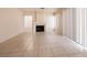 Spacious living room with a fireplace and neutral tile flooring at 7620 Tortola Bay Ln, Las Vegas, NV 89128