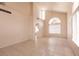 Living room with neutral tile flooring, plenty of windows, and high ceilings at 7620 Tortola Bay Ln, Las Vegas, NV 89128