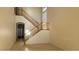 Entryway featuring tall ceilings, light colored walls and wood laminate flooring at 8768 Charm Canyon Ave, Las Vegas, NV 89178