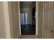 Hallway leading to the kitchen, featuring a sliding glass door at 8768 Charm Canyon Ave, Las Vegas, NV 89178