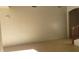 Hallway with light colored walls and wood laminate flooring at 8768 Charm Canyon Ave, Las Vegas, NV 89178