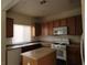 Kitchen featuring an island, light cabinetry and stainless steel appliances at 8768 Charm Canyon Ave, Las Vegas, NV 89178