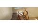 Carpeted stairway with wood railing leading to the upper level at 8768 Charm Canyon Ave, Las Vegas, NV 89178