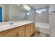Bathroom featuring a double sink vanity and bathtub at 9050 W Tropicana Ave # 1053, Las Vegas, NV 89147