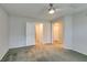 Spacious bedroom with carpet, ceiling fan, and natural light at 9050 W Tropicana Ave # 1053, Las Vegas, NV 89147