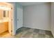 An open bedroom features stylish carpet and an en suite bathroom at 9050 W Tropicana Ave # 1053, Las Vegas, NV 89147