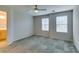 Spacious bedroom with two windows and ceiling fan at 9050 W Tropicana Ave # 1053, Las Vegas, NV 89147