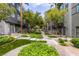 Lush landscaping and sidewalk provide easy access to building and units at 9050 W Tropicana Ave # 1053, Las Vegas, NV 89147