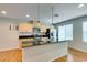 Modern kitchen featuring granite countertops, stainless appliances, and island with a sink at 9050 W Tropicana Ave # 1053, Las Vegas, NV 89147
