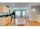 Eat-in kitchen features stainless appliances, granite countertops, and an island with seating at 9050 W Tropicana Ave # 1053, Las Vegas, NV 89147