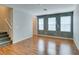 A living room features hardwood floors, staircase access, and recessed lights at 9050 W Tropicana Ave # 1053, Las Vegas, NV 89147