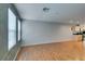 Bright living area featuring hardwood floors, kitchen view, and ample space at 9050 W Tropicana Ave # 1053, Las Vegas, NV 89147