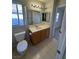 Bathroom with toilet and vanity with sink at 9641 Windborne Ave, Las Vegas, NV 89147