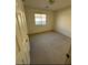 Bedroom with neutral carpet, window and standard lighting at 9641 Windborne Ave, Las Vegas, NV 89147