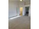 Bright main bedroom featuring neutral carpet, ceiling fan and ensuite access at 9641 Windborne Ave, Las Vegas, NV 89147