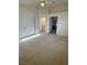 Bright primary bedroom with neutral walls, carpet and an ensuite bathroom at 9641 Windborne Ave, Las Vegas, NV 89147
