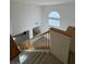 Staircase leading to a living room with great light and high ceilings at 9641 Windborne Ave, Las Vegas, NV 89147