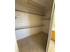 Walk-in closet with shelving and neutral carpet at 9641 Windborne Ave, Las Vegas, NV 89147