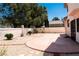 Backyard with desert landscaping including gravel and a concrete patio at 9704 Falling Star Ave, Las Vegas, NV 89117