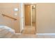 Hallway with tile floors, stairs, and neutral paint at 9704 Falling Star Ave, Las Vegas, NV 89117