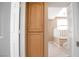 Hallway view of a cupboard with views into the home's interior at 9704 Falling Star Ave, Las Vegas, NV 89117