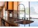 Updated kitchen featuring granite countertops, stainless steel fixtures, and ample counter space at 9704 Falling Star Ave, Las Vegas, NV 89117