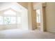 Open living space with carpet, tall ceilings and abundant natural light at 9704 Falling Star Ave, Las Vegas, NV 89117