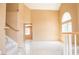 Spacious living room with high ceilings, large windows, and neutral tones, offering great natural light at 9704 Falling Star Ave, Las Vegas, NV 89117