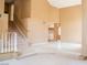 Open living space with stairs, bright tiles, and warm neutral paint colors creating an airy atmosphere at 9704 Falling Star Ave, Las Vegas, NV 89117