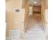 Carpeted staircase leading to upper level with wood railing at 9704 Falling Star Ave, Las Vegas, NV 89117