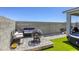 Private backyard features artificial turf, seating, bbq area and a built in hot tub at 9772 Alpine Style Dr, Las Vegas, NV 89166