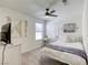 Inviting bedroom with a comfortable bed, neutral decor, and a ceiling fan at 9772 Alpine Style Dr, Las Vegas, NV 89166