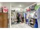 Walk-in closet featuring custom organization shelving, hanging racks and plenty of storage at 9772 Alpine Style Dr, Las Vegas, NV 89166