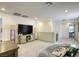Open living space featuring a large TV, neutral tones, comfortable seating, and soft carpeting at 9772 Alpine Style Dr, Las Vegas, NV 89166