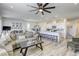 Spacious living room showcases an open floor plan, seamlessly connecting to the kitchen and dining area at 9772 Alpine Style Dr, Las Vegas, NV 89166