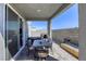 Covered outdoor patio features a bbq area, dining table and mountain views at 9772 Alpine Style Dr, Las Vegas, NV 89166