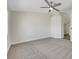 Spacious bedroom with a ceiling fan and neutral carpeting at 9962 Catalina Canyon Ave, Las Vegas, NV 89147