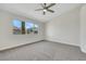 Bright bedroom with a ceiling fan and large window at 9962 Catalina Canyon Ave, Las Vegas, NV 89147
