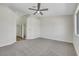 Spacious bedroom with a ceiling fan and plush carpet at 9962 Catalina Canyon Ave, Las Vegas, NV 89147