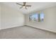 Spacious bedroom with a ceiling fan, and large window at 9962 Catalina Canyon Ave, Las Vegas, NV 89147