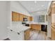Spacious kitchen with wood cabinetry, stainless steel appliances, and ample counter space at 9962 Catalina Canyon Ave, Las Vegas, NV 89147