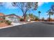 Charming single-story home with a well-maintained yard and a two-car garage on a sunny day at 9962 Catalina Canyon Ave, Las Vegas, NV 89147