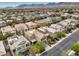 Wide aerial view of a residential neighborhood with mountain views in the distance at 10425 White Princess Ave, Las Vegas, NV 89166