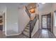 Inviting entryway featuring stairs, wood floors, and a decorative front door at 10425 White Princess Ave, Las Vegas, NV 89166
