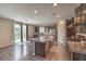 Spacious kitchen with granite counters, dark wood cabinets and stainless appliances at 10425 White Princess Ave, Las Vegas, NV 89166