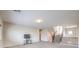 Bright living room with access to staircase; neutral carpet, and a contemporary design at 10425 White Princess Ave, Las Vegas, NV 89166